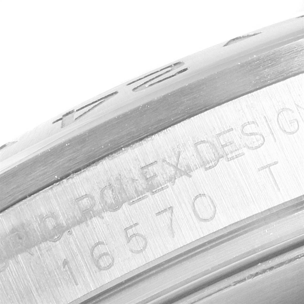 This close-up image shows the engraved bezel and case side of the Rolex Explorer 16570 Men's Stainless Steel White Dial 16570 Men's Stainless Steel White Dial model.