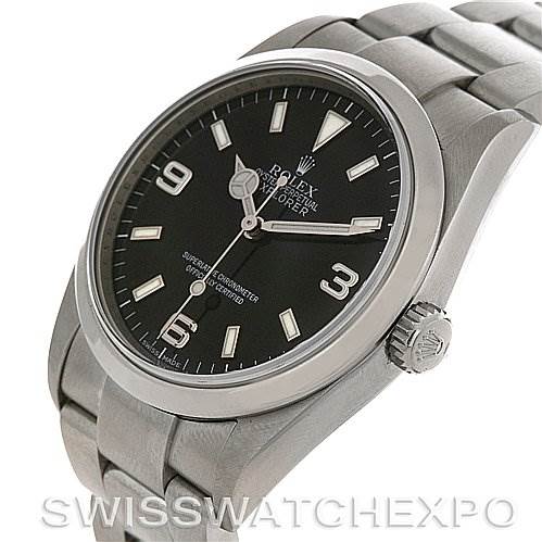 The image shows a side angle view of a Rolex Explorer 114270 Men's Stainless Steel Black Dial 114270 Men's Stainless Steel Black Dial watch, highlighting the face, crown, and part of the stainless steel bracelet.