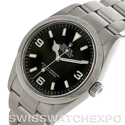 The image shows a Rolex Explorer 114270BKAO Men's Stainless Steel Black Dial 114270BKAO Men's Stainless Steel Black Dial watch at a slight angle, highlighting the watch face, crown, and stainless steel bracelet.