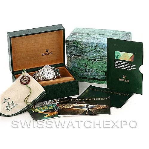 The image shows a Rolex Explorer 16570 Men's Stainless Steel White Dial 16570 Men's Stainless Steel White Dial watch, its presentation box, manuals, a tag, and a cloth, all viewed from a front angle.
