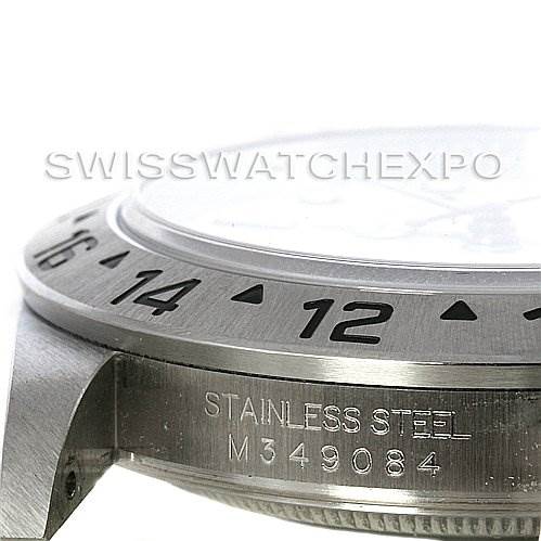 The image shows a side angle of a Rolex Explorer 16570 Men's Stainless Steel White Dial 16570 Men's Stainless Steel White Dial watch, focusing on the bezel and case with the "Stainless Steel" engraving.