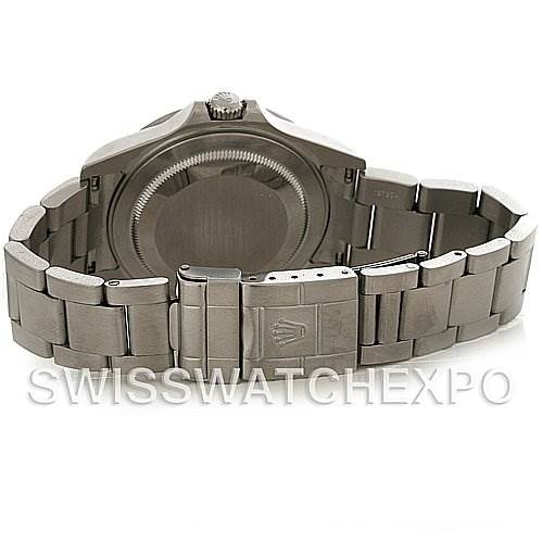 This image shows the back and bracelet of a Rolex Explorer 16570 Men's Stainless Steel White Dial 16570 Men's Stainless Steel White Dial watch from an angle looking towards the closed clasp and case back.