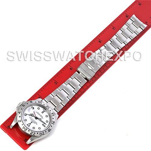 The image shows a top-down view of a Rolex Explorer 16570 Men's Stainless Steel White Dial 16570 Men's Stainless Steel White Dial watch with a stainless steel bracelet, displayed next to a red ruler.