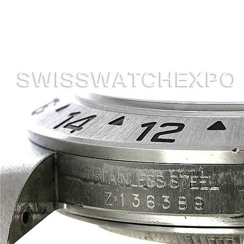 This image shows a close-up angle of the side of a Rolex Explorer 16570 Men's Stainless Steel Black Dial 16570 Men's Stainless Steel Black Dial watch, focusing on the engraved serial number and part of the bezel.