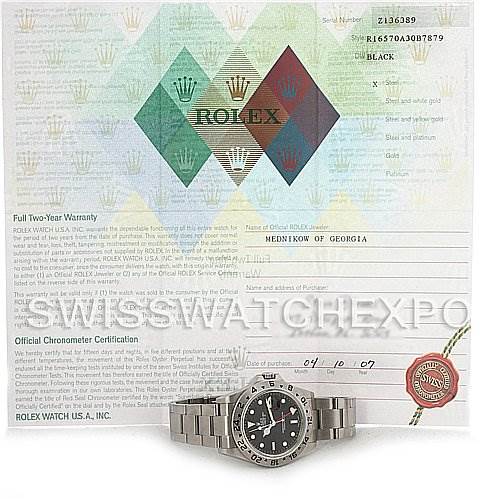 The image shows a Rolex Explorer 16570 Men's Stainless Steel Black Dial 16570 Men's Stainless Steel Black Dial watch placed in front of a warranty certificate, viewed from the front.