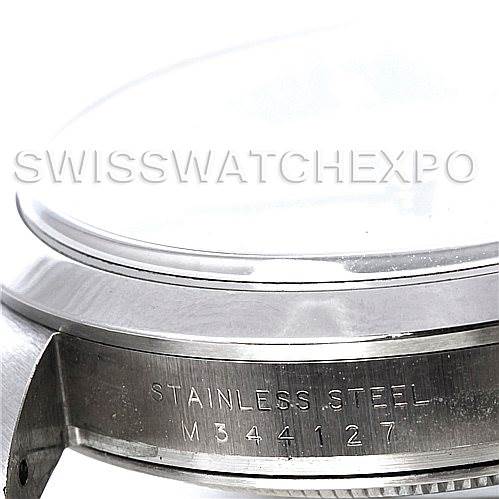 The image shows a side view of the stainless steel case and bezel of a Rolex Explorer 114270 Men's Stainless Steel Black Dial 114270 Men's Stainless Steel Black Dial watch, displaying the serial number.