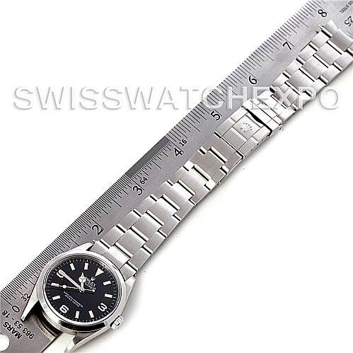 The image shows a Rolex Explorer 114270 Men's Stainless Steel Black Dial 114270 Men's Stainless Steel Black Dial watch laid flat with a ruler next to its stainless steel bracelet for size reference.
