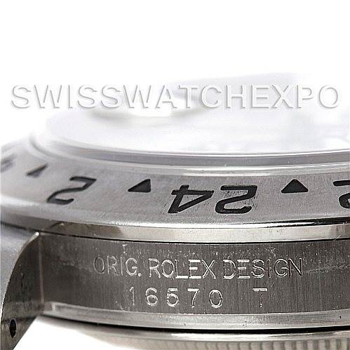 This image shows a close-up side angle of a Rolex Explorer 16570 Men's Stainless Steel White Dial 16570 Men's Stainless Steel White Dial watch, focusing on the bezel and engraved model number.