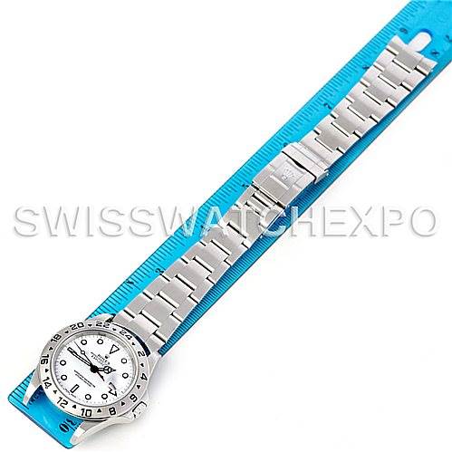 The image shows a top-down view of the Rolex Explorer 16570 Men's Stainless Steel White Dial 16570 Men's Stainless Steel White Dial watch, showcasing its dial, bezel, and full bracelet placed beside a ruler.