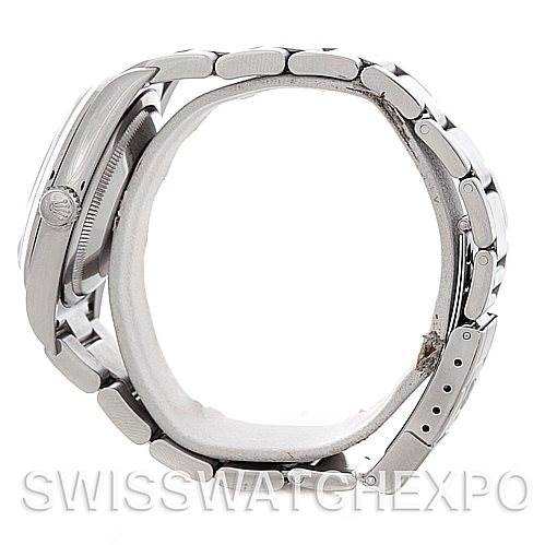 The image shows the side profile of a Rolex Explorer 114270 Men's Stainless Steel Black Dial 114270 Men's Stainless Steel Black Dial, highlighting the crown and bracelet links.