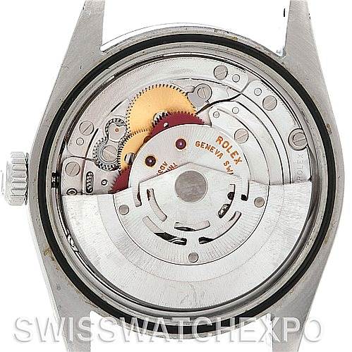 The image shows the internal mechanism of a Rolex Explorer 114270 Men's Stainless Steel Black Dial 114270 Men's Stainless Steel Black Dial model watch from a rear view, highlighting gears and the rotor.