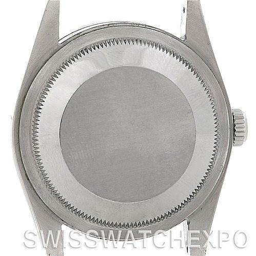 This image shows the back case of a Rolex Explorer 114270 Men's Stainless Steel Black Dial 114270 Men's Stainless Steel Black Dial watch, with a crown on the side, viewed from the back.