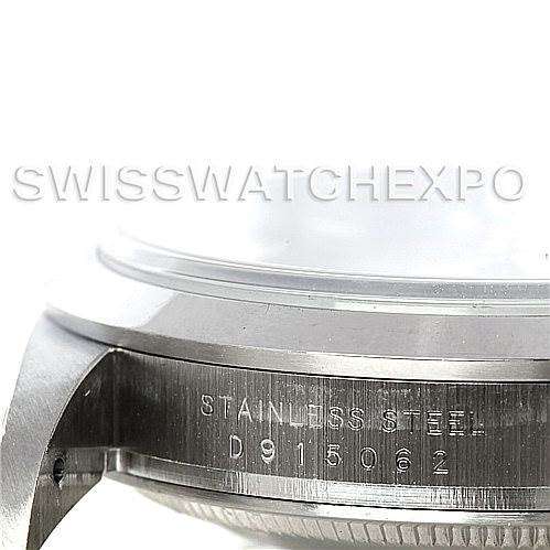 This image shows a close-up of the side and bottom edge of the caseback of a Rolex Explorer 114270 Men's Stainless Steel Black Dial 114270 Men's Stainless Steel Black Dial watch, highlighting the serial number.