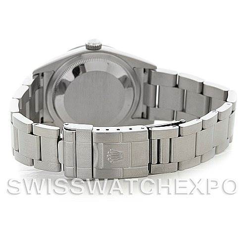 The image shows the back view of a Rolex Explorer 114270 Men's Stainless Steel Black Dial 114270 Men's Stainless Steel Black Dial, highlighting its case back, crown, and stainless steel bracelet with a clasp.