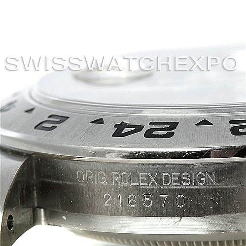 This image shows a side view of the Rolex Explorer 216570 Men's Stainless Steel Black Dial 216570 Men's Stainless Steel Black Dial watch, focusing on the bezel and engraved serial number.