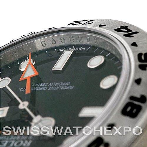 This close-up angle of the Rolex Explorer 216570 Men's Stainless Steel Black Dial 216570 Men's Stainless Steel Black Dial shows the bezel, part of the dial, and the hands, with a focus on the watch's details.