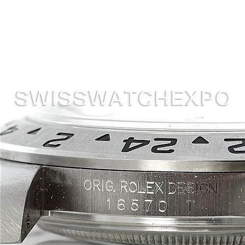 This close-up shows the side of a Rolex Explorer 16570 Men's Stainless Steel White Dial 16570 Men's Stainless Steel White Dial watch, featuring the engraved model number 16570 and part of the bezel and casing.