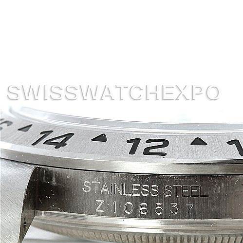 This image shows a close-up of the bezel and the engraved serial number on the side of the Rolex Explorer 16570 Men's Stainless Steel White Dial 16570 Men's Stainless Steel White Dial watch.