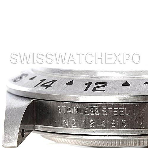 The image shows a close-up side view of the Rolex Explorer 16570 Men's Stainless Steel White Dial 16570 Men's Stainless Steel White Dial watch, focusing on the stainless steel case and engraved serial number.