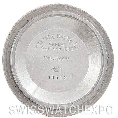 The image shows the interior of a Rolex Explorer 16570 Men's Stainless Steel White Dial 16570 Men's Stainless Steel White Dial model's case back, displaying engraved text and numbers.