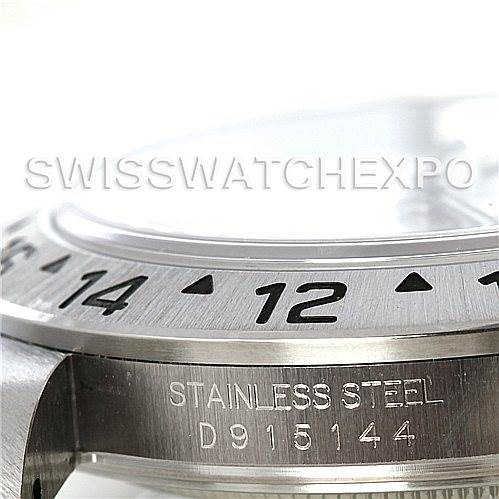 Close-up of the stainless steel side profile and bezel of the Rolex Explorer 16570 Men's Stainless Steel White Dial 16570 Men's Stainless Steel White Dial watch, showing engraved details and part of the case.