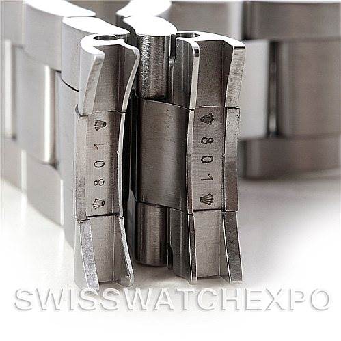 The image shows a close-up angle of the metal bracelet links of a Rolex Explorer 16570 Men's Stainless Steel White Dial 16570 Men's Stainless Steel White Dial watch, highlighting the clasp and engraved parts.