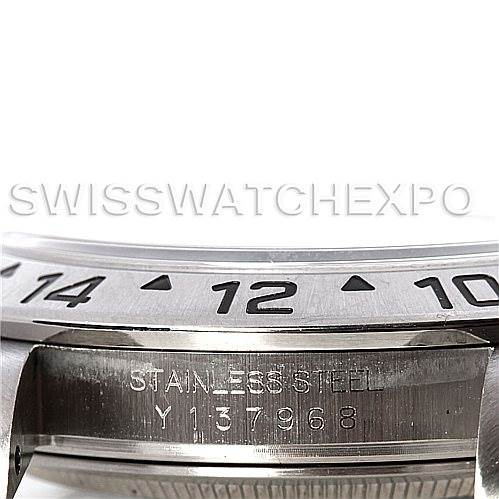 The image shows a close-up of the bezel and part of the stainless steel casing with serial number for a Rolex Explorer 16570 Men's Stainless Steel White Dial 16570 Men's Stainless Steel White Dial watch.