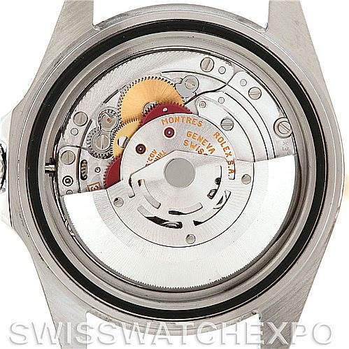 This image shows the internal mechanism of a Rolex Explorer 16570 Men's Stainless Steel White Dial 16570 Men's Stainless Steel White Dial watch from the back, highlighting the movement and various gears.