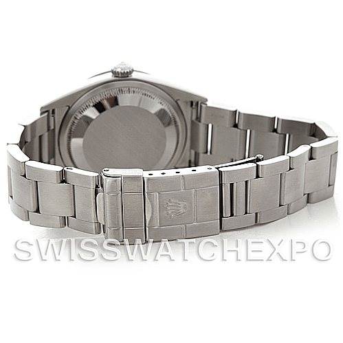 The image shows the back view of a Rolex Explorer 114270 Men's Stainless Steel Black Dial 114270 Men's Stainless Steel Black Dial watch, highlighting the case back, crown, and bracelet with the clasp.