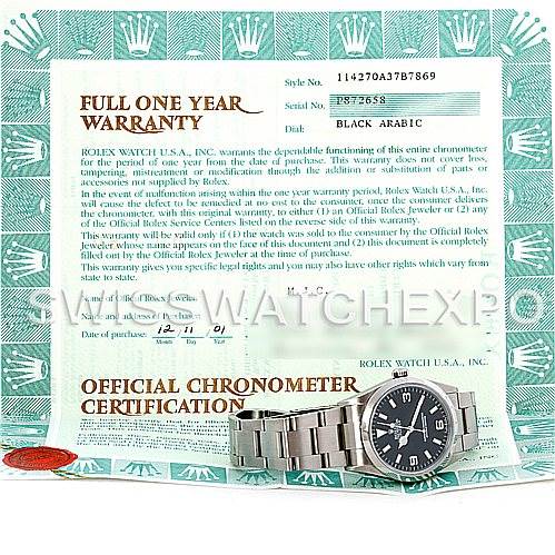 The image shows a Rolex Explorer 114270 Men's Stainless Steel Black Dial 114270 Men's Stainless Steel Black Dial watch and its metal band placed over a warranty and chronometer certification document.