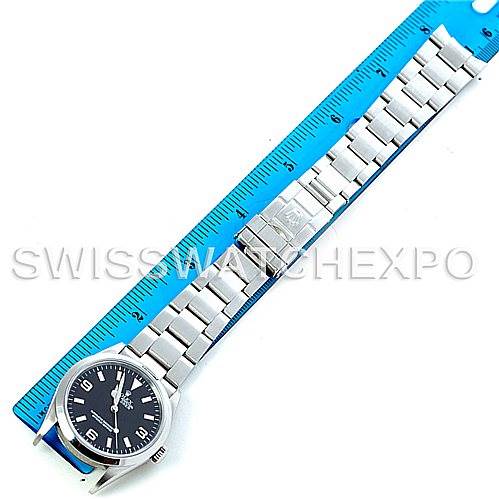 The image shows a Rolex Explorer 114270 Men's Stainless Steel Black Dial 114270 Men's Stainless Steel Black Dial watch laid flat with a blue ruler next to it for measurement.