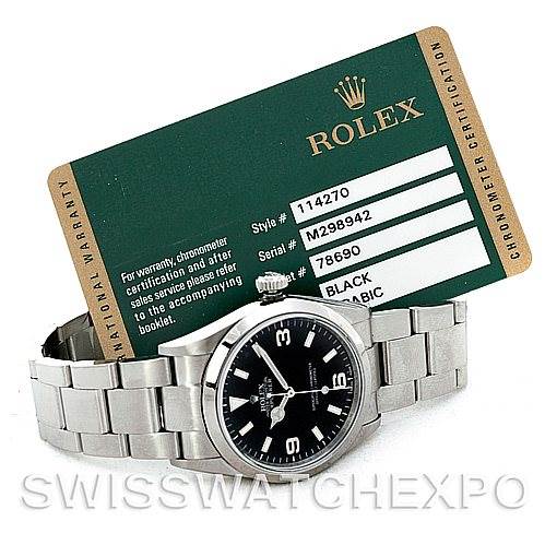The image shows a Rolex Explorer 114270 Men's Stainless Steel Black Dial 114270 Men's Stainless Steel Black Dial watch lying flat with its bracelet and a Rolex warranty card visible.