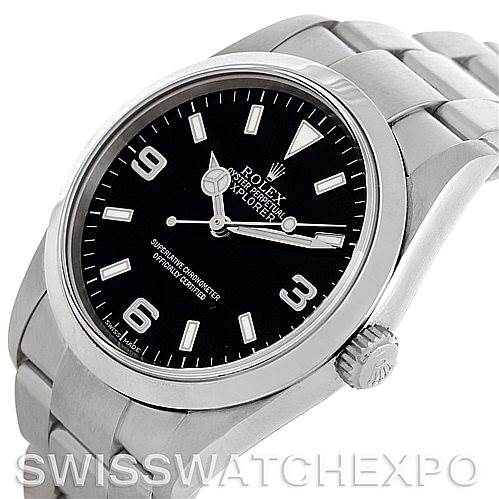The Rolex Explorer 114270 Men's Stainless Steel Black Dial 114270 Men's Stainless Steel Black Dial watch is shown from a slightly angled top-down view, highlighting the dial, bezel, crown, and part of the bracelet.