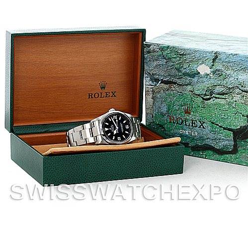 The image shows a Rolex Explorer 114270 Men's Stainless Steel Black Dial 114270 Men's Stainless Steel Black Dial watch displayed in its open box, alongside the outer packaging.