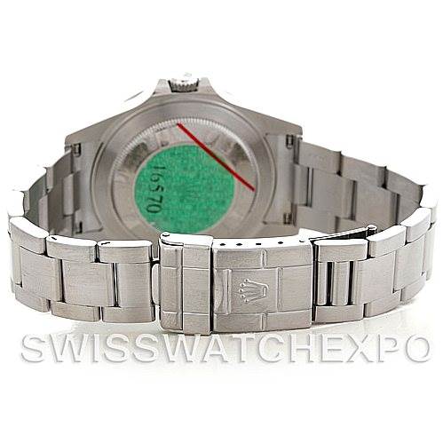 The image shows a Rolex Explorer 16570 Men's Stainless Steel White Dial 16570 Men's Stainless Steel White Dial's back case and metal bracelet with a deployment clasp.