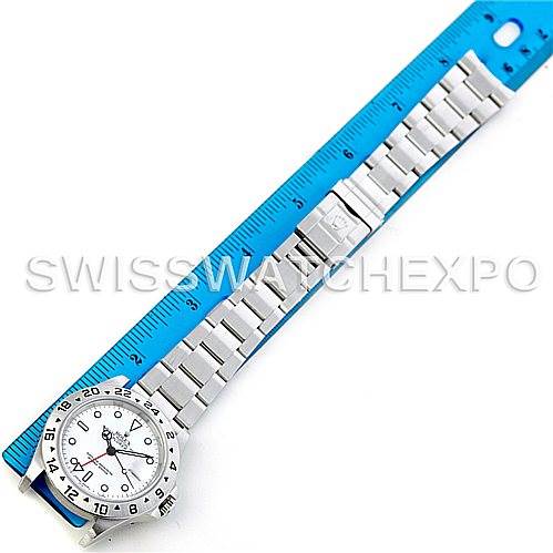 The image shows a top-down view of a Rolex Explorer 16570 Men's Stainless Steel White Dial 16570 Men's Stainless Steel White Dial watch placed next to a ruler for scale.