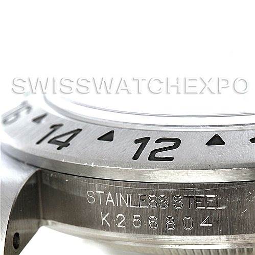 The image shows a close-up of the bezel and part of the case with the serial number of a Rolex Explorer 16570 Men's Stainless Steel White Dial 16570 Men's Stainless Steel White Dial watch.