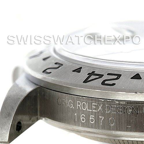 The image shows a close-up of the side of the Rolex Explorer 16570 Men's Stainless Steel White Dial 16570 Men's Stainless Steel White Dial, focusing on the bezel with 24-hour markings and part of the case with the model number 16570.