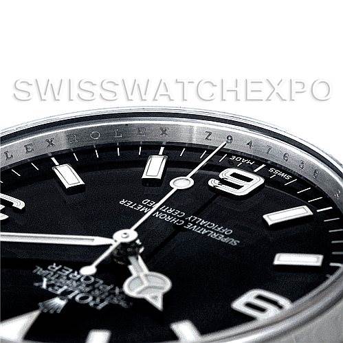 The image shows a close-up angle of the Rolex Explorer 114270 Men's Stainless Steel Black Dial 114270 Men's Stainless Steel Black Dial, highlighting the edge of the bezel and part of the dial.