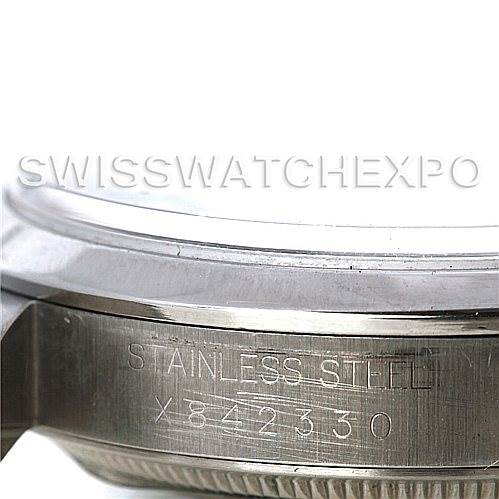 The image shows a close-up side view of the Rolex Explorer 14270 Men's Stainless Steel Black Dial 14270 Men's Stainless Steel Black Dial revealing the "STAINLESS STEEL" engraving and serial number.