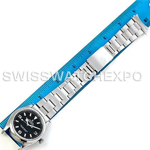 The image shows a Rolex Explorer 14270 Men's Stainless Steel Black Dial 14270 Men's Stainless Steel Black Dial watch laid flat with its full stainless steel bracelet, next to a ruler for measurement.