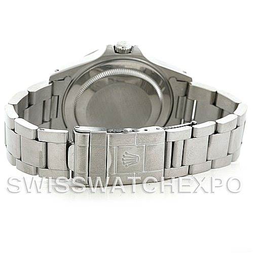 The image shows the back view of a Rolex Explorer 16570 Men's Stainless Steel White Dial 16570 Men's Stainless Steel White Dial watch, displaying the case back, bracelet, and clasp with the Rolex crown logo.