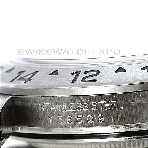The image shows a close-up side angle of the bezel and serial number of a Rolex Explorer 16570 Men's Stainless Steel White Dial 16570 Men's Stainless Steel White Dial model watch.