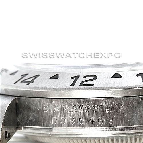 This close-up shows the side view of the bezel and case of a Rolex Explorer 16570 Men's Stainless Steel White Dial 16570 Men's Stainless Steel White Dial watch, featuring the model number and stainless steel inscription.