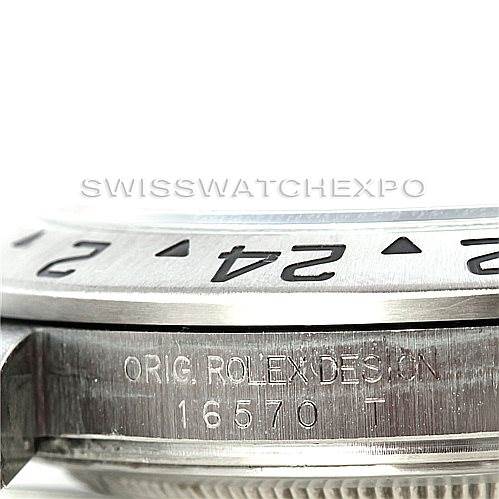 The image shows a close-up side angle of a Rolex Explorer 16570 Men's Stainless Steel White Dial 16570 Men's Stainless Steel White Dial watch, focusing on the bezel and the engraved model number (16570).