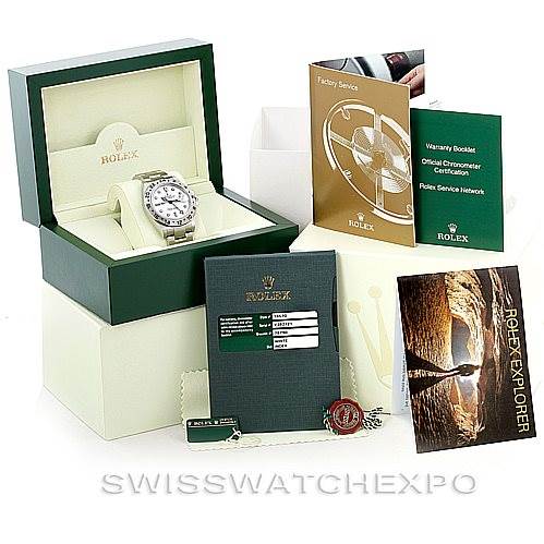 This image shows a Rolex Explorer 16570 Men's Stainless Steel White Dial 16570 Men's Stainless Steel White Dial watch with its open box, warranty booklet, certification, factory service booklet, and hang tags.