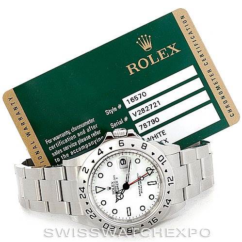 This image shows a Rolex Explorer 16570 Men's Stainless Steel White Dial 16570 Men's Stainless Steel White Dial watch and its accompanying warranty card from a front angle.