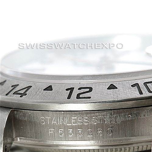 The close-up image shows the side profile of a Rolex Explorer 16570 Men's Stainless Steel White Dial 16570 Men's Stainless Steel White Dial's stainless steel case and part of its engraved bezel.