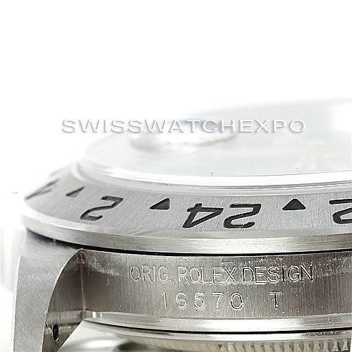 The image shows a close-up view of the Rolex Explorer 16570 Men's Stainless Steel Black Dial 16570 Men's Stainless Steel Black Dial's bezel and case, highlighting the engraved model number 16570.