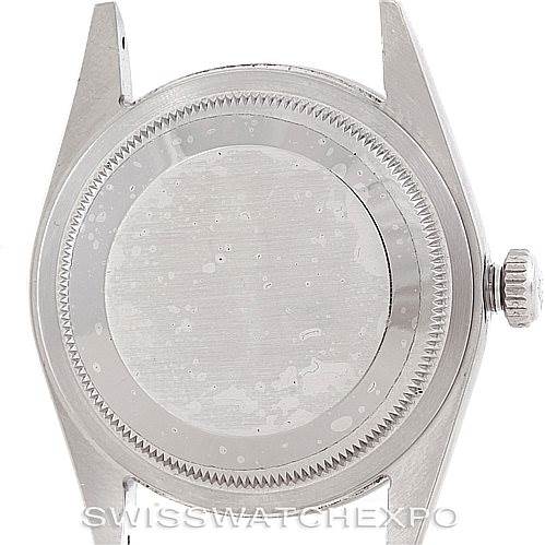 This image shows the back case and crown of a Rolex Explorer 114270 Men
s Stainless Steel Black Dial 114270 Men
s Stainless Steel Black Dial watch from a top-down angle.